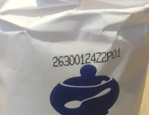 A photo of a 1kg pack of sugar's batch code