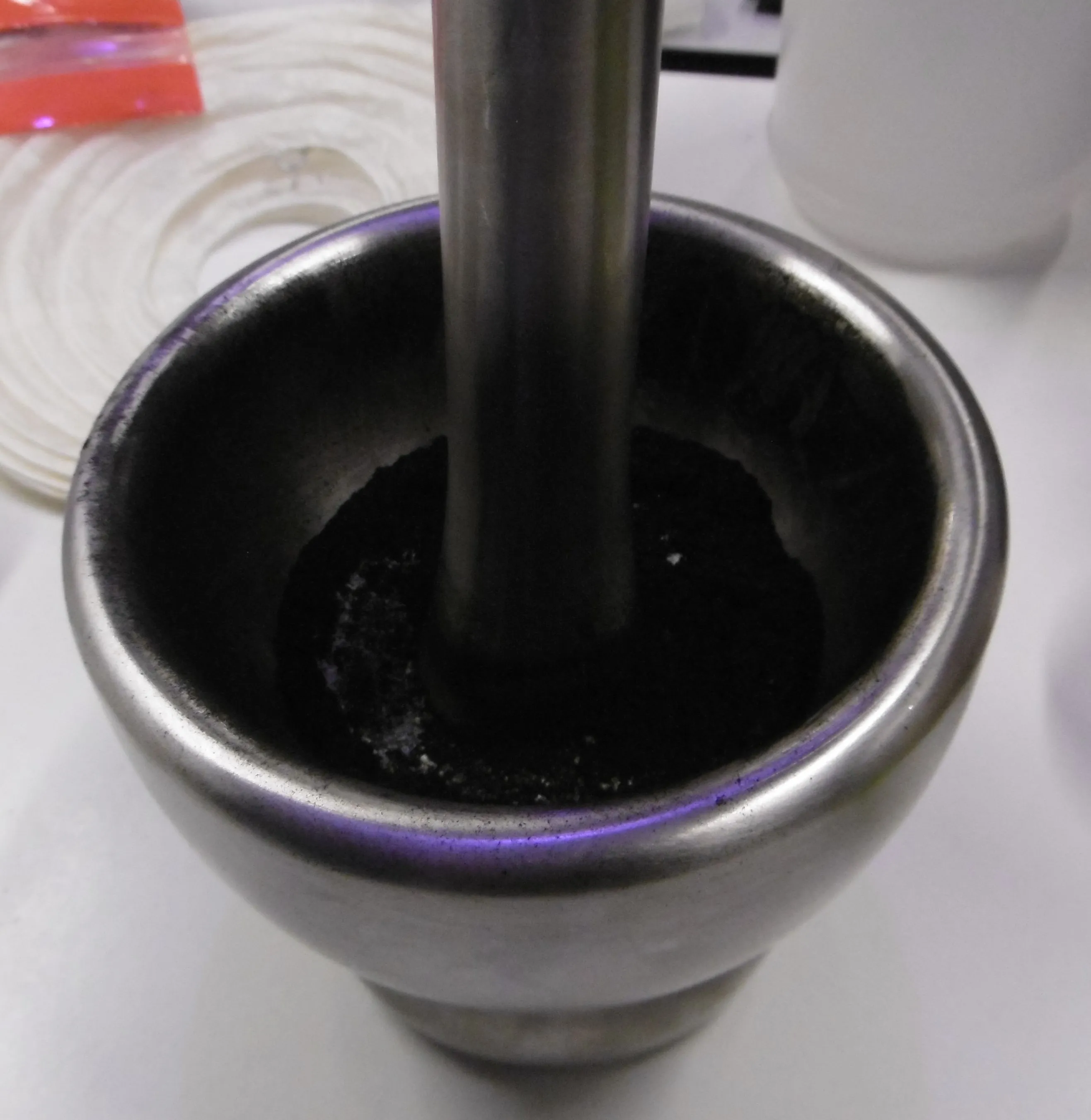 A mortal and pestle filled with powder